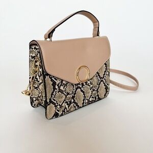 A new day pink snake print cross body handbag